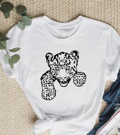 "Leopard Shirt, Animal Lovers Shirt, Baby Leopard, Gift for Men and Women, Inspirational Shirt, Cute Animals, Peeking Leopard, Animal Gift. WELCOME TO \"GoldenShirtDesign\" ! High quality and super soft, comfortable shirt. Made with top of the line vinyl and pressed with a professional grade heat press. All our simple color ones like White, Black, and Red are 100% Cotton. All our Heathered Colors are cotton/polyester blend and they are super comfy soft! SIZING AND COLORS Make sure you check our Animal Clothing, Camping Shirts, Baby Leopard, Leopard Shirt, Print Ideas, Leopard Animal, Inspirational Shirt, Animal Tshirt, Animal Shirts