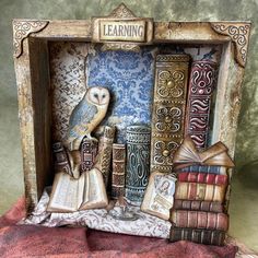 an owl sitting on top of books in a book shelf with the word learning written above it