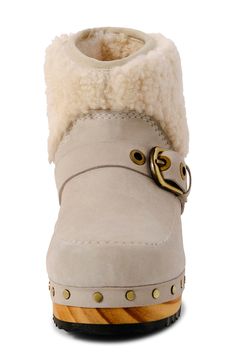 Fuzzy shearling trim updates the cozy-chic vibes of this clog-inspired boot while polished studs accentuate the wood-grain sole. 1 1/2" heel 5" shaft Pull-on style Cushioned footbed Leather and genuine shearling (India) upper and lining/rubber sole Imported Sheepskin Clogs, Dust Bunny, Clog Boots, Chic Vibes, Shearling Boots, Cozy Chic, Kids Sneakers, Low Heels, Wood Grain