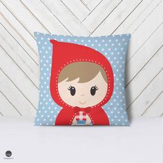 a pillow with a little red riding hood on it