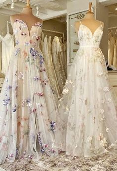 two dresses on mannequins in a store