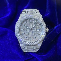 ICECARTEL exclusive Bust Down Moissanite Watch is now available, made of stainless steel and PVD plated with a thick layer of 14K White Gold. This moissanite watch is iced out with round, colorless (D-Color), VVS moissanite flawless diamonds. All of the diamonds on this bust-down watch are guaranteed to pass the diamond tester. This moissanite watch features a self-winding mechanism that gets Its energy from natural motion of the wearer (mainspring).Every watch comes in an universal size that ca Moissanite Watch, Circle Face, Custom Jewelry Box, Flawless Diamond, Diamond Tester, Wrist Game, Gold Circle, Moissanite Jewelry, Mechanical Movement