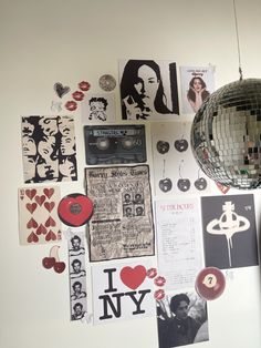 the wall is covered with posters and disco balls