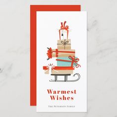 a holiday card with a stack of presents on top and the words happy holidays written below it