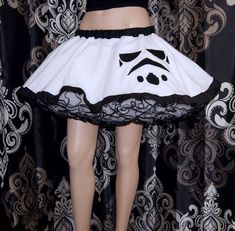 "The main fabric is soft White Bridal Tulle. The waistband is Black cotton over elastic. Then I finished it off with more black piping on the hem. It's the perfect companion crinoline for my Storm Trooper Circle skirt shown in last picture (not included with this listing) This skirt is stitched and serged to last a lifetime. It's safe for the washing machine and the dryer. Measurements: Waist Size Small: 24\" to 32\" Medium: 33\" to 42\" Large: 42\" to 50\" Length: 14\" NOTE This listing is only Storm Trooper Helmet, Disney Tutu, Costume Tutu, Crinoline Skirt, Hartford Ct, Tutu Costumes, Storm Trooper, White Bridal, Disney Style