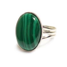 This classic gemstone ring features a natural, semi-precious Malachite cabochon (18 x 13 mm) on an elegant band.Malachite is a very beautiful natural earth stone banded in various green hues.The Sterling silver plated ring is adjustable so one size fits all. Nickel and lead free.This ring is available in other gemstone options from my Etsy store. Matching Malachite jewellery is available.***********************************************************Gemstone informationMalachite is a very beautiful Steampunk Rings, Green Gemstone Ring, Precious Rings, Malachite Rings, Malachite Jewelry, Semi Precious Gems, Magical Jewelry, Gothic Rings, Green Hues