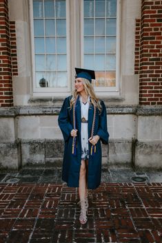 a woman in a graduation gown and cap