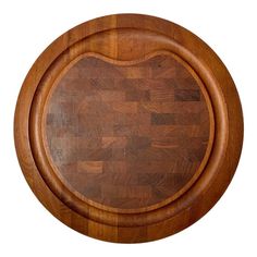 a large wooden cutting board on top of a white background with an oval shape in the center