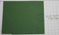 a piece of green paper sitting on top of a cutting mat with the words end marks