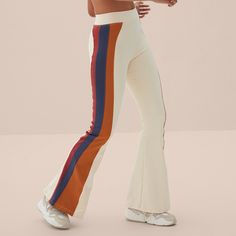 Color Blocking Flare The Flare Pants With Mixed Block Colors Have A Slightly Wide-Leg Design With Strategic Contrasting Panels To Enhance Your Silhouette. They Are Made From Bynature Fabric, Promoting Health Benefits For Muscles And Skin. Made In Brazil. Stretch Wide Leg Bottoms With Color Block, Stretch Wide Leg Color Block Bottoms, Fitted Casual Color Block Pants, Spring White Color Block Pants, Fitted Color Block Pants For Summer, Fitted Summer Color Block Pants, Summer Color Block Fitted Pants, Retro Spring Color Block Bottoms, High Waist Fitted Color Block Pants