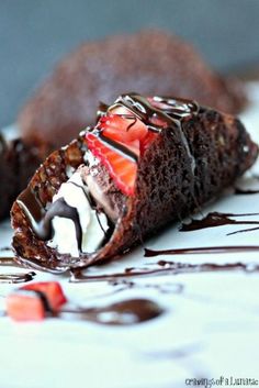 a piece of cake with chocolate and strawberries on it