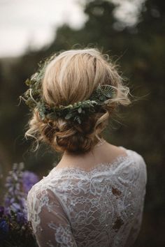 a woman wearing a flower crown in her hair