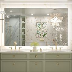 a bathroom with two sinks and a large mirror over it's vanity area,