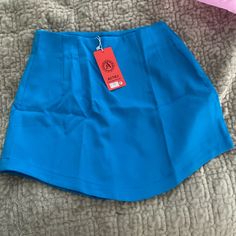 From A Boutique Em Brazil, Never Worn Trendy Blue Mini Skirt, Blue Stretch Skirted Skort, Blue Stretch Skort, Blue Stretch Pleated Skort, Stretch Blue Pleated Tennis Skirt, Blue Stretch Pleated Tennis Skirt, Trendy Blue Stretch Mini Skirt, Trendy Stretch Blue Skirt, Trendy Lined Blue Mini Skirt