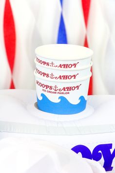 three cups sitting on top of each other in front of an american flag wallpaper