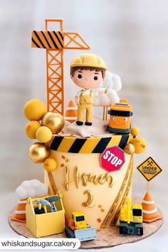 a cake with construction themed decorations on it