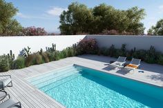 an empty swimming pool surrounded by greenery