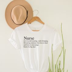 Nurse Definition T-Shirt | Nurse Gift T-Shirt | Nurse Graduation Gifts | Nurse School Shirt | New Nurse Gift | Hospital Shirt | Healthcare Are you or a friend a healthcare worker, nurse (RN / LPN / NP / etc) or soon-to-be graduate of Nursing School? WE APPRECIATE YOU! Wear this t-shirt loud and proud! We use super soft, high quality Bella Canvas tees. This tee is the color White. Other colors available upon request. These shirts are Unisex & preshrunk, please see size chart in listing photos for Short Sleeve Shirt With Funny Print For Everyday, Everyday Slogan Shirt With Short Sleeves, Everyday Short Sleeve Slogan Shirt, Everyday Short Sleeve Shirt With Letter Print, Everyday Short Sleeve Shirt With Text Print, Nurse Definition, New Nurse Gift, Nurse School, Nurse Graduation