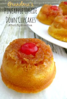 pineapple upside down cupcakes on white plates with text overlay that reads grandma's pineapple upside down cupcakes