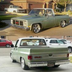 two different trucks parked next to each other in front of a house and another truck