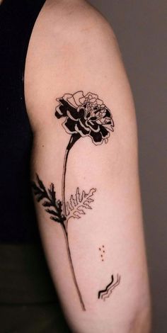 a black and white photo of a flower on the left upper half of the arm