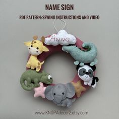 a stuffed animal wreath with name sign on it