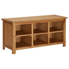 a wooden shelf with several compartments on it