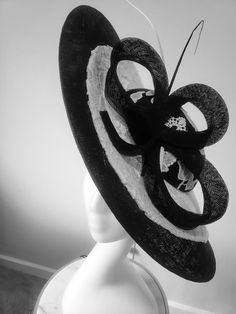 This is a gorgeous wide brim hat handcrafted with sinamay, mat and cord lace. This is a must have for mothers of bride/groom for that special day, it is also ideal for Derby, Royal ascot, wedding guest and all your special occasions. We don't repeat our designs, please get this before it's gone. It comes in black/ivory and red/ivory. Handmade Fitted Hats For Formal Occasions, Handmade Fitted Formal Hats, Formal Fitted Handmade Hats, Handmade Fitted High Crown Mini Hats, Handmade Fitted Mini Hat With High Crown, Elegant Handmade Hat For Formal Occasions, Handmade Elegant Brimmed Boater Hat, Elegant Handmade Brimmed Hat, Elegant Handmade Top Hat With Short Brim