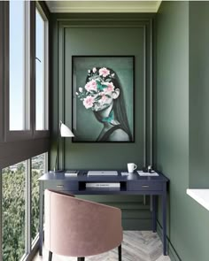 a room with a desk, chair and painting on the wall in front of it