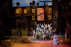 a group of people standing on top of a stage