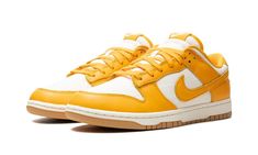 The Nike Dunk Low “University Gold” is a head-turning colorway of the always-popular retro basketball shoe.  The upper is complete with a Coconut Milk-colored hemp woven base with University Gold leather overlays and Swoosh branding.  A “Nike” logo is embroidered on the heel, and “Nike” and Swoosh logos appear on the University Gold nylon tongue tag.  University Gold laces, a Coconut Milk rubber midsole, and a Gum rubber outsole complete the look.  Release date: May 22, 2024 Nike Dunk Low Peach Cream, Dunk Lows, Retro Jordans 11, Sneaker Outfits, Retro Basketball Shoes, Nike Elite Socks, Yellow Nikes, Nike Gold, Dunks Nike