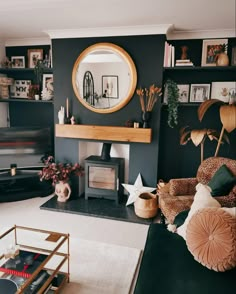 a living room filled with furniture and a fire place