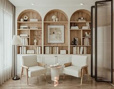 a living room filled with furniture and bookshelves next to a wall mounted book case