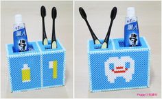 two toothbrush holders made out of legos with toothpaste and tooth brushes in them