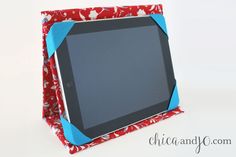 a red and blue tablet case sitting on top of a white table