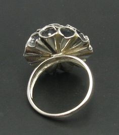 Sterling silver ring 925/1000, flower. Stamped 925. Approximate weight 14.0 grams. Top width 2.4cm. All our jewels are made from solid sterling silver 925/1000 and are carefully crafted by hand in our family workshop. We dispatch your orders in 5 working days, worldwide and the postage is $5. We ship registered priority mail. Please allow 5-7 working days for delivery in Europe and 10-15 working days outside Europe. For any questions - please do not hesitate to contact me! Elegant Handmade Silver Dome Ring, Silver Hallmarked Dome Ring Fine Jewelry, Silver Oval Hallmarked Flower Ring, Silver Sterling Oval Flower Ring, Silver Oval Flower Ring Hallmarked, Hallmarked Silver Oval Flower Ring, Fine Jewelry Silver Oval Flower Ring, Silver Open Ring Flower Design For Anniversary, Silver Oval Flower Ring Fine Jewelry