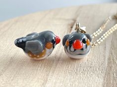 This Australian Zebra Finch glass beads necklace is cute and dainty, which is a perfect gift for kids and friends.  It is made of the following: 🔹 Handmade glass beads: H10 x W12 x D18mm, each bead is unique so there is a slightly different from bead to bead 🔹 Necklace chain: gold or silver plated over brass 🔹 Necklace Length: choose the exact length of the chain (the length includes clasp and findings).   【PLEASE NOTE THE FOLLOWINGS BEFORE PURCHASE】 ✔ VAT, GST and any other taxes from your country are NOT included in the listing price. Buyers are responsible for any aforesaid taxes and must be paid upon delivery. ✔ Buyers are responsible for any customs and import taxes that may apply. I'm not responsible for delays due to customs. ✔ Colors may vary on different computer monitors and i Glass Necklaces With Tiny Beads For Gifts, Glass Necklace With Tiny Beads For Gift, Playful Jewelry With Tiny Beads For Gifts, Whimsical Round Beads Necklace As A Gift, Whimsical Glass Necklaces As Gifts, Whimsical Glass Necklace For Gifts, Whimsical Glass Necklace For Gift, Glass Bead Jewelry For Gifts, Whimsical Czech Glass Necklaces As Gifts