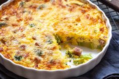 a casserole dish with broccoli and cheese