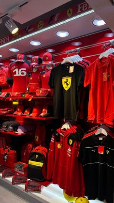 a store display filled with lots of red and black shirts