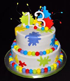 a birthday cake with colorful decorations on it