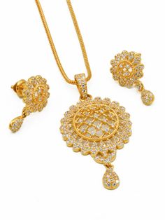 Add a touch of elegance and playfulness to any outfit with our 22ct Gold CZ Pendant Set. This unique set includes a stunning pendant and matching earrings, all weighing in at 12.51 grams. Purity: 22ct gold Chain not included. Elegant Round Pendant Jewelry For Diwali, Yellow Gold Cubic Zirconia Jewelry Sets With Matching Earrings, Festive Gold Jewelry Sets With Cubic Zirconia, Dazzling Gold Jewelry Sets With Intricate Design, Dazzling Gold Jewelry Sets For Festive Occasions, Dazzling Gold Jewelry Sets For Festive Season, Diwali Gold Jewelry Sets With American Diamonds, Pandant Earring Set In Gold, Festive Yellow Gold Cubic Zirconia Jewelry