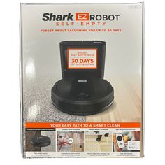 the shark ez robot self - empty is in its box with instructions on how to use it