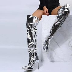 Made from premium materials, these boots feature a high-gloss finish that reflects light beautifully, akin to a mirror. The sleek design is complemented by a form-fitting silhouette that extends gracefully over the knee, creating a seamless line that elongates the legs. The interior is lined with a soft, breathable fabric to ensure comfort during extended wear, while the non-slip sole ensures practicality on various surfaces. Features: High quality. Material: PU + Rubber. -Choose the larger size Mirror Boots, Costume Africain, Bota Over, Pointy Toe Boots, High Heel Stiefel, Silver Boots, Basic Boots, Patent Boots, Thigh Boot