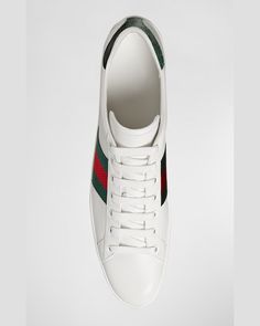 Gucci "New Ace" leather lowtop sneaker. Green/red/green nylon web detail. Green crocodile detail at back. Rubber sole. Made in Italy. Gucci Men Shoes Sneakers, Red High-top Gucci Sneakers, Gucci Low-top Custom Sneakers For Sports, Gucci Low-top Sneakers With Logo, Custom Gucci Low-top Sneakers With Embroidered Logo, Gucci Custom Low-top Sneakers With Embroidered Logo, Gucci Ace Sneakers, Green Crocodile, Web Detail