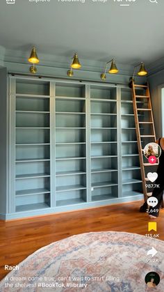 the room is empty and has many bookshelves