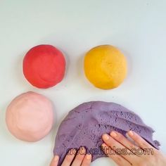 three different colored doughs being made with hands