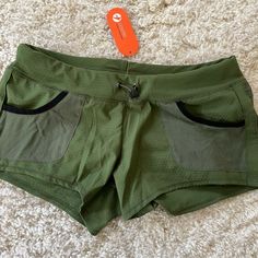 A Great Pair Of Shorts. New With Tags. Size 4. Green Workout Shorts With Side Pockets, Green Athletic Shorts With Pockets, Green Stretch Athletic Shorts With Pockets, Stretch Shorts With Hip Pockets For Summer, Summer Workout Shorts With Pockets, Green Stretch Shorts With Side Pockets, Green High-waisted Athletic Shorts With Pockets, Workout Bottoms With Hip Pockets, Compression Running Shorts