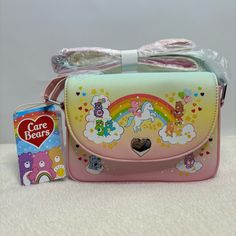 Loungefly Care Bears Rainbow Ombre Crossbody Bag - Brand New With Tags And In Plastic Description: Step Into Care-A-Lot With The Cutest Crossbody Bag. The Ombre Purse Features Your Favorite Care Bears On Rainbow And Clouds, With Rainbow Hearts All Over. Comes With A Silver-Tone Heart Embossed On The Flap And Interior Pink Lining With A Drop Pocket. It Also Features A Multi Color Crossbody Strap. Measures Approximately 5-1/2" High X 7-1/2" Wide X 2" Deep Made Of Polyurethane (Vegan Leather), With Cute Crossbody Satchel Gift, Cute Multicolor Shoulder Bag With Phone Holder, Cute Multicolor Satchel With Adjustable Strap, Cute Multicolor Shoulder Bag With Phone Pocket, Cute Multicolor Shoulder Bag With Adjustable Strap, Cute Multicolor Crossbody Shoulder Bag, Cute Multicolor Rectangular Shoulder Bag, Cute Satchel With Adjustable Strap In Pouch Shape, Cute Satchel With Adjustable Strap And Pouch Shape