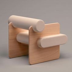 a wooden chair with two white handles on it