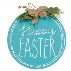 a blue sign that says happy easter with greenery on the front and bottom of it